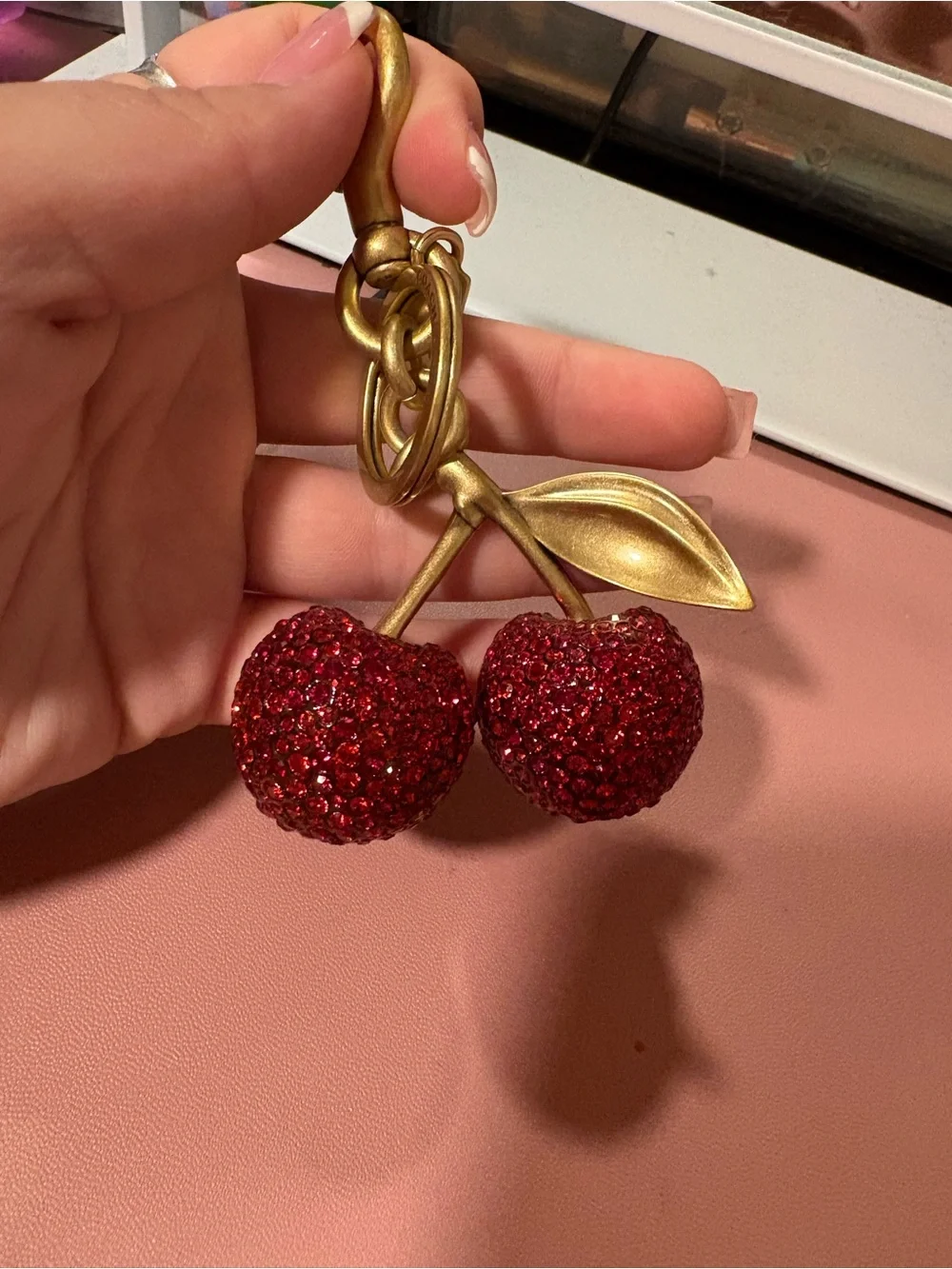 Coach Gold-Tone Cherry Charm Keychain with Red Crystals